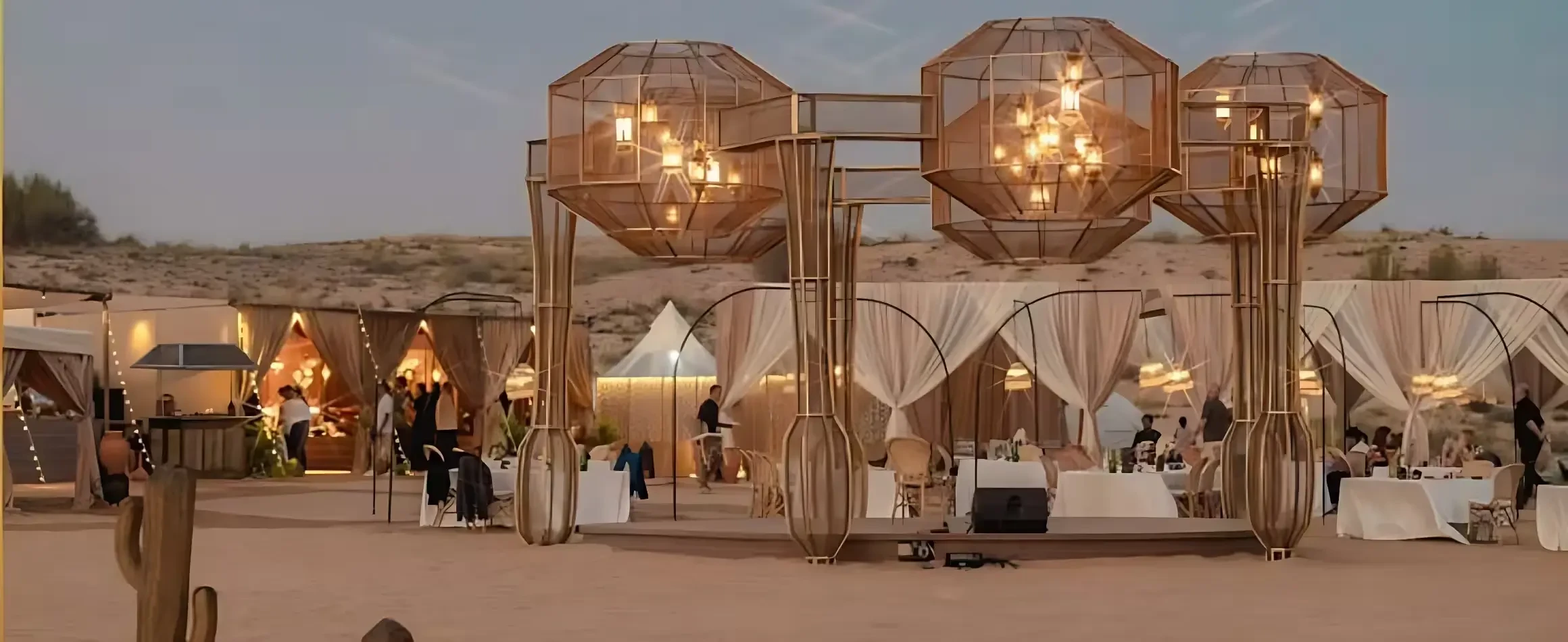 Open-air desert restaurant with guests dining during VIP safari experience