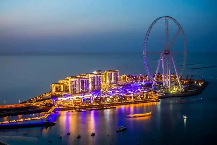 Iconic Burj Khalifa beside the Emirates Airline Wheel, highlighting Dubai's stunning urban landscape and attractions.