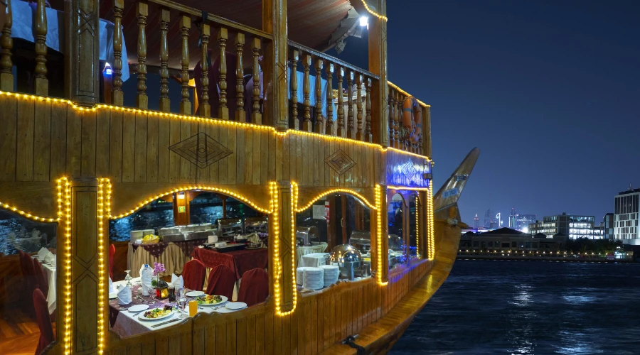 Dubai dhow cruise dinner boat illuminated at night