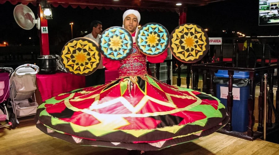 Traditional entertainment performance aboard a Dubai dhow cruise