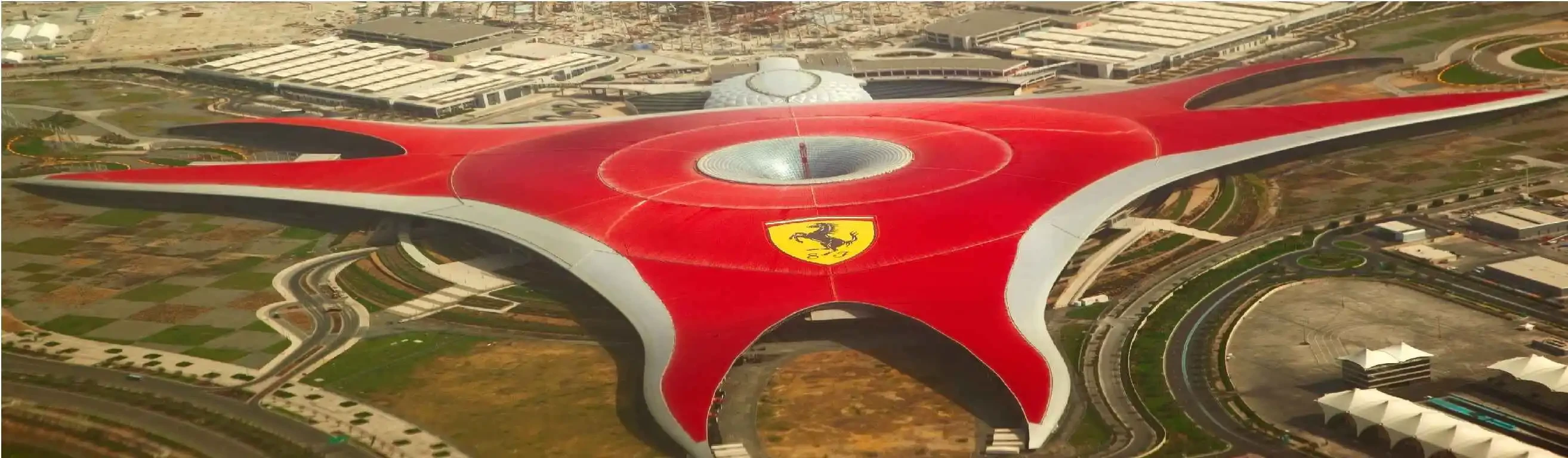 Exterior view of the Ferrari Museum in Abu Dhabi, showcasing the distinctive red roof of Ferrari World.