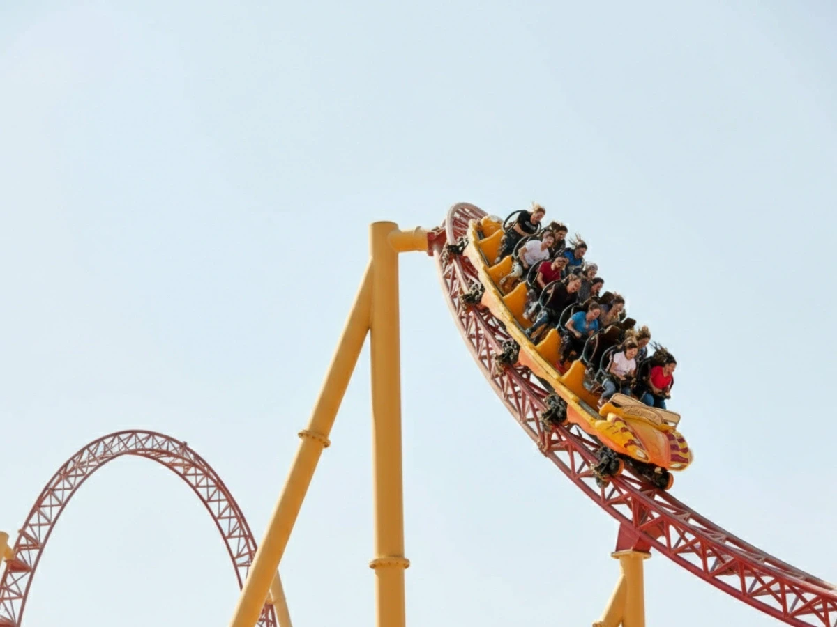 Thrill seekers on a high-speed roller coaster at IMG Worlds of Adventure, one of the top tourist attractions in Dubai.