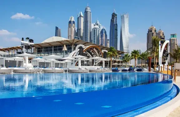 Infinity pool at Marina Bay Sands hotel in Dubai, showcasing stunning views of the skyline and Zero Gravity Dubai.