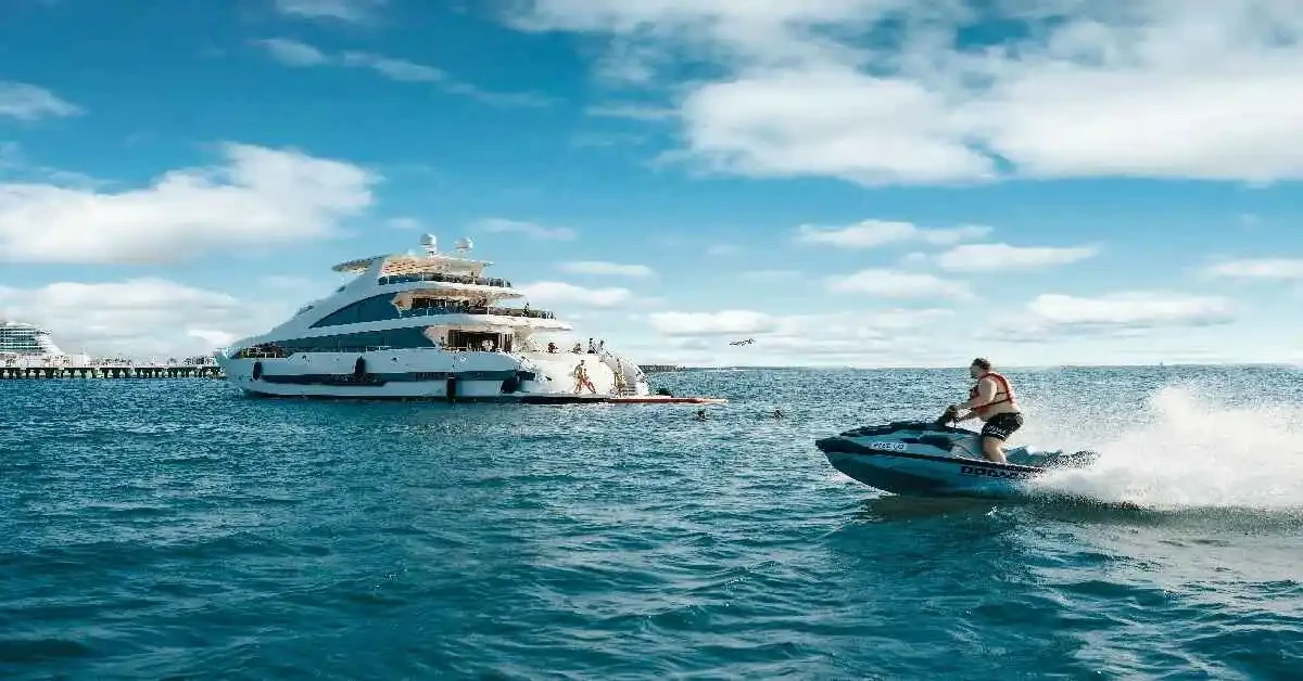 A rider on a jet ski navigating the ocean waters in Dubai, highlighting the dynamic movement and scenic backdrop.