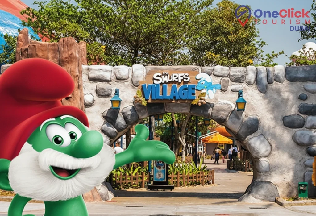 Papa Smurf character statue standing in front of the stone archway at Smurfs Village in Motiongate Dubai.