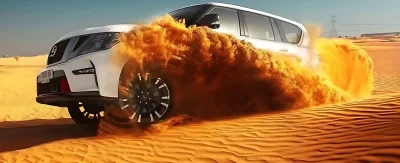 SUV drifting on Dubai desert dunes during adventure safari ride
