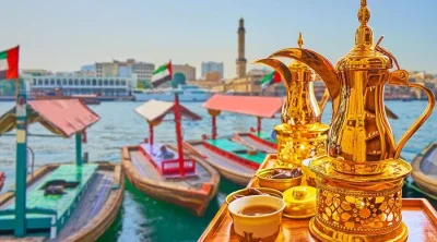 Traditional boats and Arabic coffee overlooking Dubai Creek