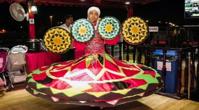 Traditional entertainment performance aboard a Dubai dhow cruise