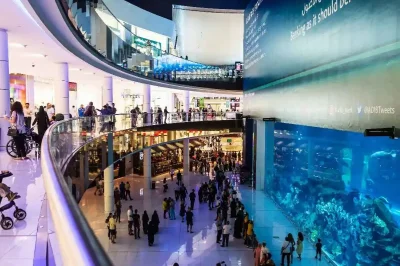 The Dubai Mall features an underwater aquarium and zoo, showcasing diverse marine life in a stunning shopping environment.