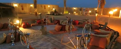 Hookah setup and glowing lights during Dubai desert safari night experience