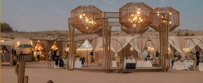 Open-air desert restaurant with guests dining during VIP safari experience