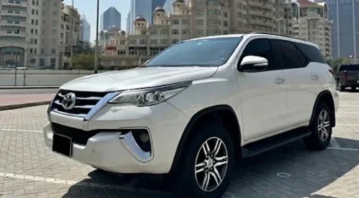 toyota-fortuner-rental-front-cityscape.